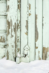 Old painted wall with peeling paint cracked surface