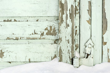 Old painted wall with peeling paint cracked surface