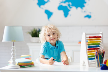 Child with abacus doing homework after school.