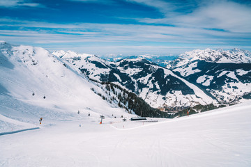 Ski lefts and cable cars in the Alps winter resort. People going up for skiing and snowboarding....