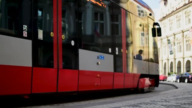 The reflection of the building on the tram in Prague
