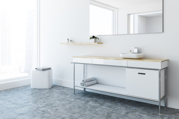 Fototapeta na wymiar White sink vanity unit in loft bathroom, side