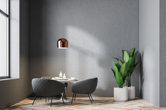 Table in a gray wall restaurant interior