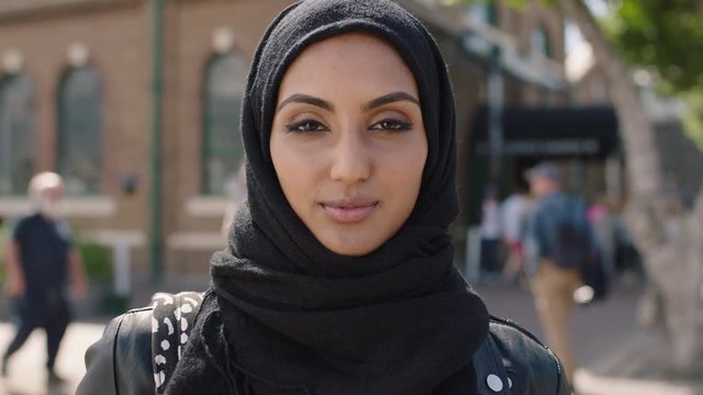 portrait of young beautiful muslim woman looking serious confident at camera wearing hijab headscarf