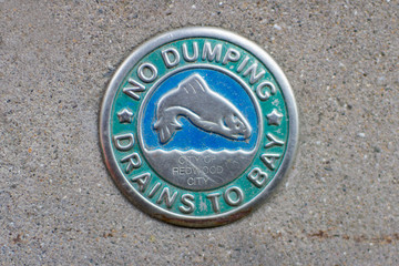 No Dumping Drains to Bay Sidewalk Sign With Fish, Waves - Found in Redwood City, California
