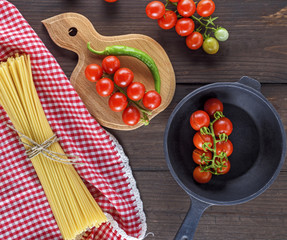 long pasta raw tied up with rope and ingredients