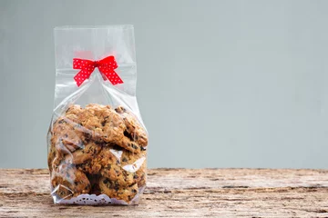 Meubelstickers chocolate chip cookies in plastic bag packaging with copy space. © abimagestudio