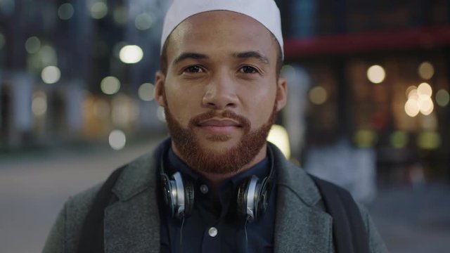 Close Up Portrait Of Young Muslim Man Entrepreneur Looking Confident Pensive At Camera Commuting In City Evening