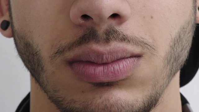 close up man mouth smiling happy facial hair style masculine beauty wearing piercings