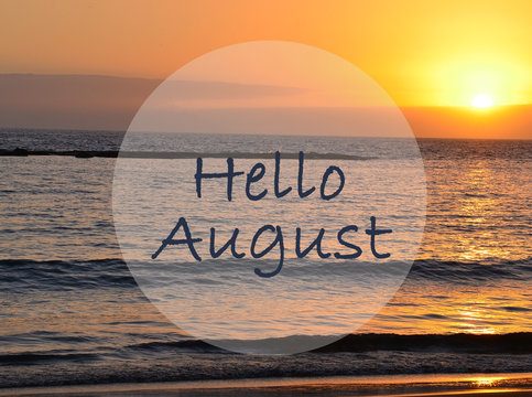 Hello August greeting on ocean sunset background.Summer concept. Selective focus.