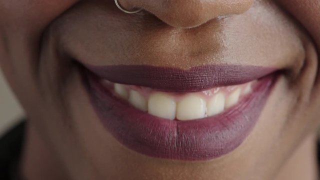 close up beautiful african american woman lips smiling happy mouth showing healthy teeth