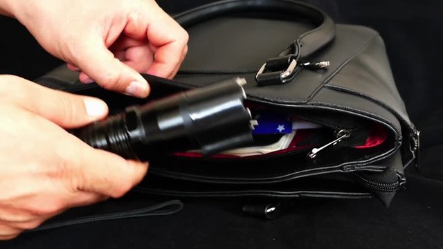 possession of electro-shock in the bag, women and electro shock device,

