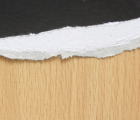 torn paper texture on wood background, copy space.
