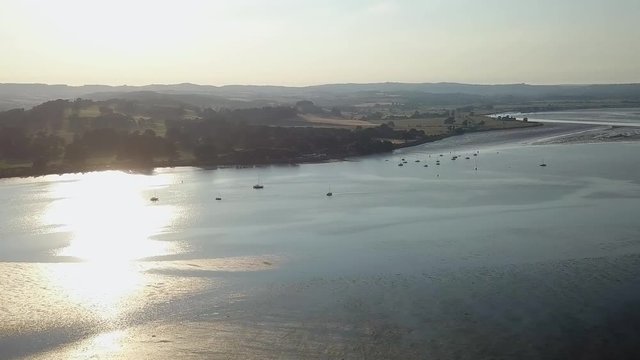 AERIAL VIDEO overlooking the river at sunset in Lympstone Estuary