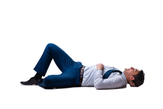 Businessman lying on the floor isolated on white