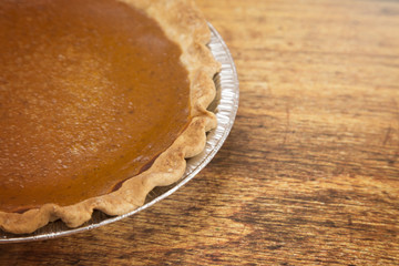 Pumpkin or Sweet Potato Pie on a Wooden Table