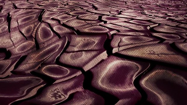 Abstracto de movimiento sobre terreno arcilloso agrietado. Superficie con textura terrosa que se deforma y ondula