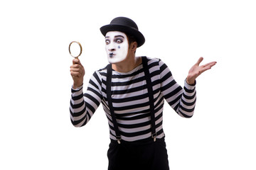 Mime with loupe isolated on white background