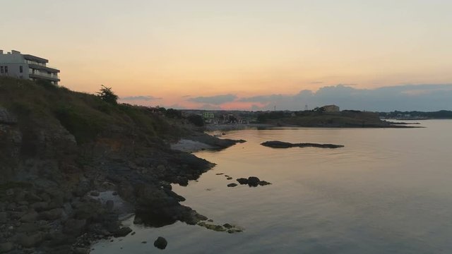 Low flight over seashore rocks at sunset Aerial 4k Black Sea -Bulgaria ,Carevo