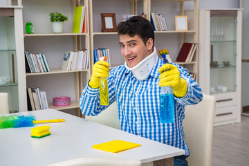 Man with neck unjury cleaning house in housekeeping concept