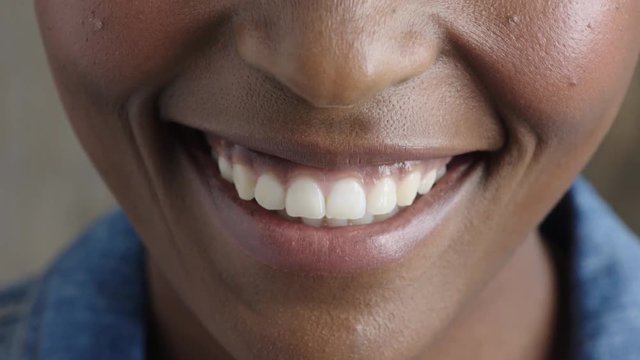 close up african american woman mouth smiling lips showing healthy teeth dental health concept