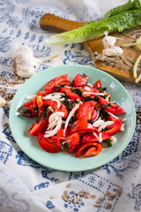 Vegetables salad with tomatoes, wakame seaweed, onion, herbs and spices. Vegan lunch, vegetarian dinner, healthy food.