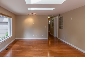 Fototapeta na wymiar empty living room with wood floors and beige walls