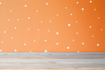 Kids table and starry orange wall