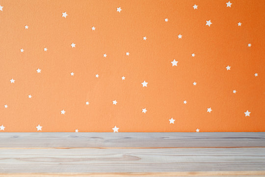 Kids table and starry orange wall