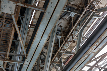 rusty metal train track bridge structure. bottom view