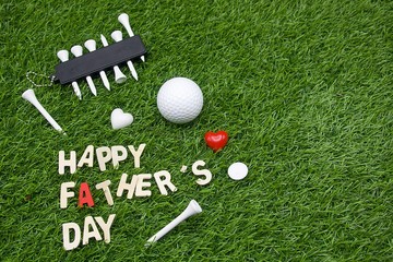 Happy Father's day to golfer with golf ball is on green grass