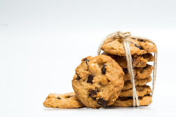 A stack of chocolate chip cookies isolated on a white background