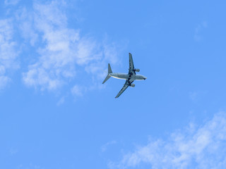 A modern aircraft flying high in the sky.