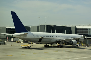 Fototapeta na wymiar Close-up of large passenger aircraft on runway in airport. 