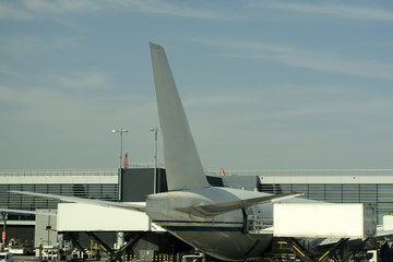 Close-up of large passenger aircraft on runway in airport. 