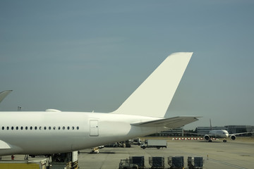 Close-up of large passenger aircraft on runway in airport. 