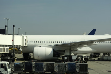 Close-up of large passenger aircraft on runway in airport. 