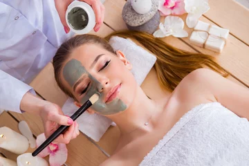 Fotobehang Young woman in spa health concept with face mask © Elnur