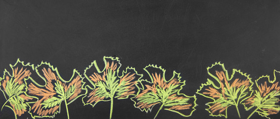 Obraz premium Banner Back to school. Drawing chalk on a blackboard Autumn leaves