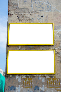 Two empty advertisement billboards on the building in the city, clipping path object
