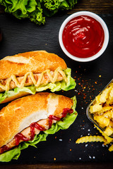 Hot dogs and french fries on cutting board