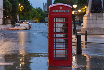 The red telephone box , famous icon of London, on Waterloo place
