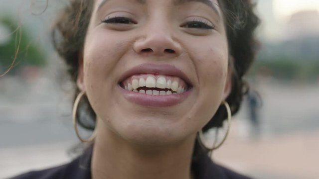 close up portrait of happy young woman business intern student laughing cheerful at camera enjoying lifestyle wearing earrings