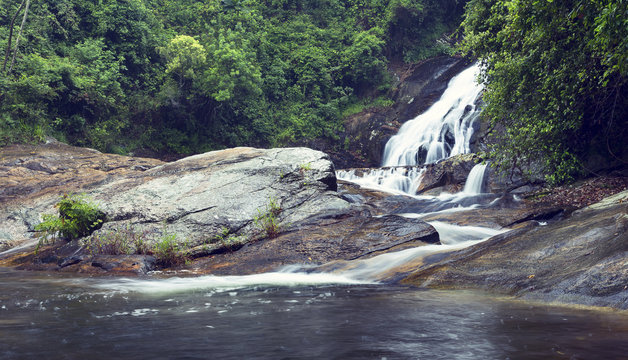 River flowing over rocks and the Debengeni Waterfall artistic conversion