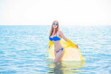 Beauty of new age. Natural pretty young girl in swimsuit near the sea. Size plus and xl lady....