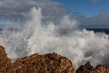 Wave spray at West Point State reserve beach, Tasmania, Australia