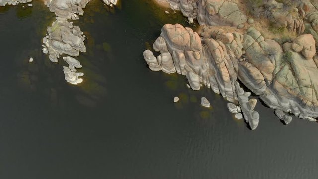 Granite dell rock formation and watson lake with horizontal movement of camera