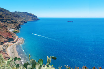 .Playa Las Gaviotas, the beach with fine black sand at the foot of the cliffs of the Anaga mountain near the Santa Cruz de Tenerife,Canary Islands. .