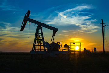Oil Pump on orange sunset