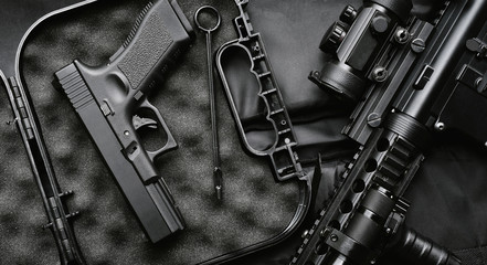 Weapons and military equipment for army, Assault rifle gun (M4A1) and handgun on black background. - obrazy, fototapety, plakaty